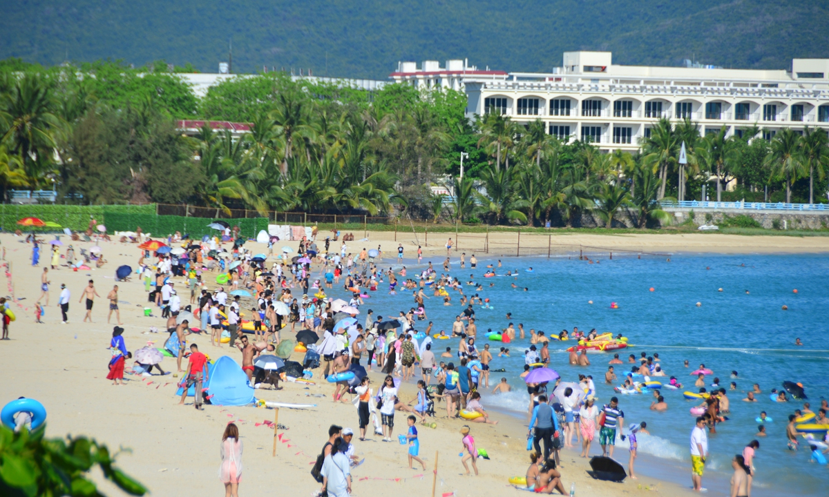 People enjoy the tropical beach of Sanya, South China's Hainan Province during the May Day holidays. Photos: IC